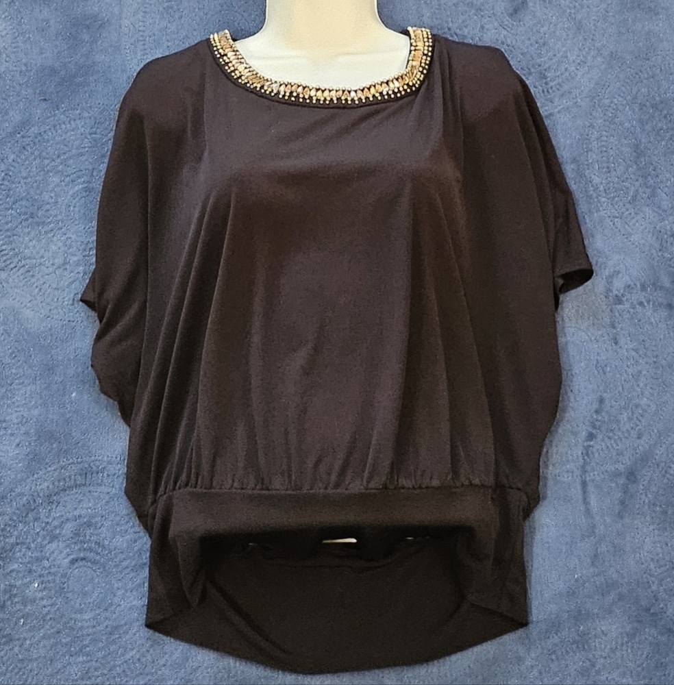 Amy wear, women's size M medium. Black blouse. Used in good condition